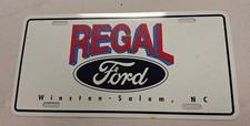 Vintage Regal Ford Winston Salem NC Metal License Plate Tag Red,White,Blue,Black picture