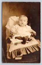1904-1918 RPPC Adorable Baby Sitting On Chair w/ Little Shoes ANTIQUE Postcard picture