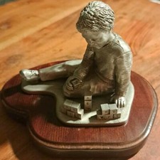 BETHANY CHRISTIAN SERVICES RESTORE HOPE PEWTER BOY W/ BLOCKS PAPERWEIGHT picture
