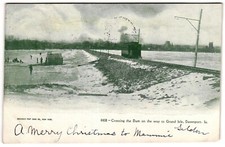 Crossing the Dam on the way to Grand Isle Davenport Iowa Winter c1900s Postcard picture
