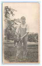 1904-1918 Early Young Man Holding Angry Pig RPPC Postcard Portrait Farm picture