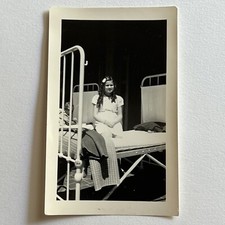 Vintage B&W Snapshot Photograph Adorable Little Girl Orphan Sitting On Bed picture