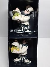 Chef S & P Shakers Holding A Tray picture