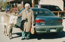 2000s Elderly Old Woman Petting Donkey Burro Route 66 Roadside Travel Portrait picture