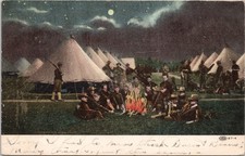 1907 MILITARY POSTCARD-SOLDIERS AT NIGHT AROUND CAMPFIRE-TENTS IN BACKGROUND picture