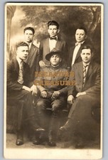 C.1915 RPPC WW1 SOLDIER CIGARETTE SURROUNDED BY FRIENDS GROUP PHOTO Postcard P99 picture