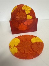 This vintage Orange Daisies 1970s Lucite coaste picture