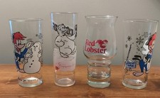 Four vintage promo glasses  1 Red Lobster 2 Arby's Woody Woodpecker & Polar Bear picture