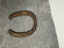 vintage, weathered, and heavily rusted metal horseshoe picture