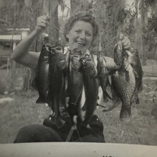 Vintage Old Candid Snapshot Photo Portrait Smiling Woman Holding String-Fish ‘56 picture