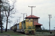 RR Photo-ILLINOIS TERMINAL IT 1501 GP7 Leading Freight Past Tower picture