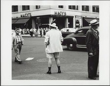 Photo:New York City Macy's 1957 Man in Shorts Feathered Hat Street Scene picture