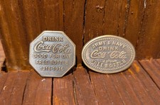 2 BRASS COKE DRINK COCA COLA TOKENS ARMY & NAVY GOOD FOR ONE FREE BOTTLE DATED picture