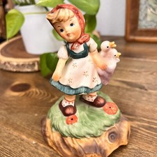 Vintage girl with ducks musical figurine picture