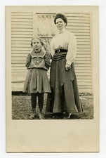 RPPC - Mother and daughter in front of house picture