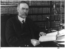Photo:[George Sutherland, half-length portrait, seated at desk] picture