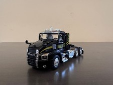 1/64 DCP/First Gear Mack Anthem Day Cab- Black w/Green Stripes picture