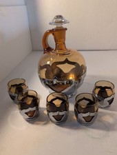 Vintage mid-century amber glass decanter set with chrome accents, five glasses. picture