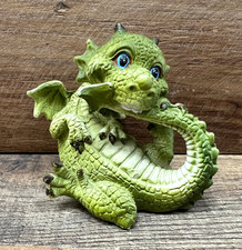Dragon Biting His Tail Resin Figurine 3