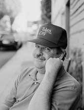 American writer Armistead Maupin wearing a Tales of the City cap 2- Old Photo picture