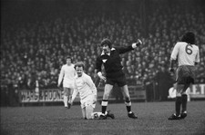 Leeds midfielder Billy Bremner gets fouled is awarded a free kick - Old Photo picture