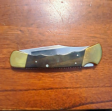 1995 Buck Lockback  Clip Point Plain Edge Stainless Blade Brass/Wood Hand picture
