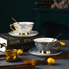 Elegant Marble Tea Set with Gold Accents – 2 Teacups, Saucers, and Spoons picture