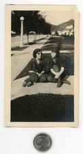 Old 1920's photo / Nerd Girl in Tinted Glasses Chats with Her Imaginary Friend picture