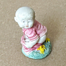 Vintage Porcelain Baby Figurine Seated Painted Pink Outfit with Flowers Small picture