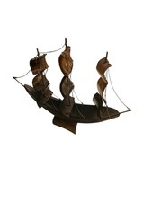 A handcrafted sailing ship fashioned from horn, complete with rigging, picture