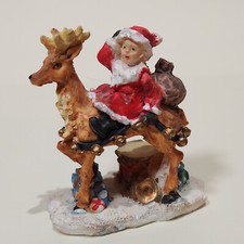 Vintage Rite Aid Holiday Figurine Girl In Santa Suit Sitting On Reindeer Ceramic picture