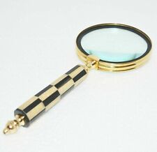 An antique, vintage brass maritime magnifying glass with a sturdy resin handle picture