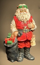 Vintage Santa Wearing Wreath Headband and Holding Angel and Sack of Gifts Resin picture