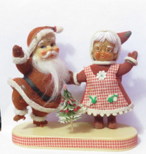 VINTAGE FELT AND PLASTIC SANTA AND MRS CLAUSE ON STAND FADED AND WORN picture