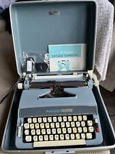 1965 BLUE MONTGOMERY WARD SIGNATURE 510 TYPEWRITER w CASE, MANUAL, AND INK picture