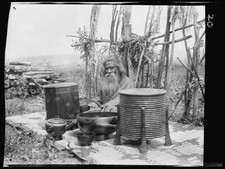 Photo:Ainu Man Japan 1900s Outdoors with Covered Containers and Mats picture