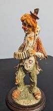 Pucci Hobo Clown playing an Accordion on wooden base picture