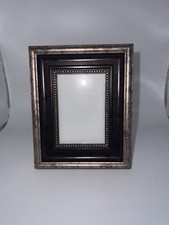 Traditional tabletop frame featuring an antique-inspired multi-layered design picture