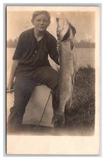 RPPC ~ Young boy Fisherman W giant Muskie ~ Fishing hunting picture