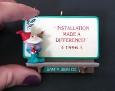 Vintage Hallmark Santa Sign Co Christmas Ornament Installation Made A Difference picture