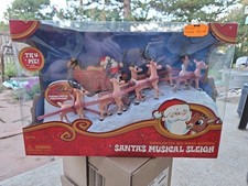 Rudolph the Red-Nosed Reindeer Forever Fun Santa's Musical Sleigh Figure Set New picture