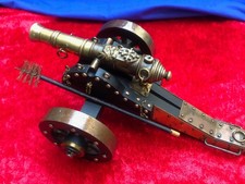 Vintage bronze and wood model of an old cannon gun. Great details, 11 X 7 X 4.5  picture