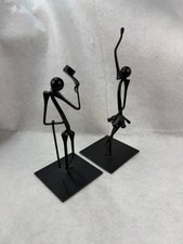 Two Black Metal Sculptures the Entertainer and the Ballerina picture