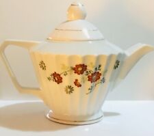 Antique Porcelain Teapot With Flower Design picture