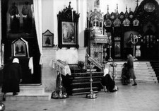 Women praying inside church of Saints Peter Paul which survived pe- Old Photo picture