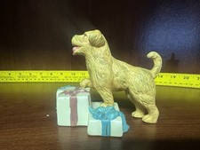 Golden Retriever dog, standing on a stack of wrapped gifts. picture