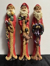 Set Of Three Holiday Santa Christmas Figurines  picture