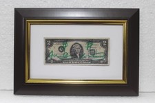 Two dollar bill signed by Andy Warhol with frame in good condition picture