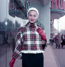Young woman wearing a white knit cap a tartan jacket red gloves a - Old Photo picture