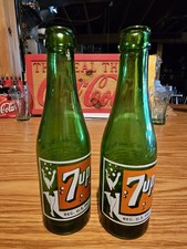 C1940s 7UP ACL 7 OUNCE BUBBLE/ BATHING SUIT GIRL GREEN GLASS BOTTLE, BOTH NICE picture